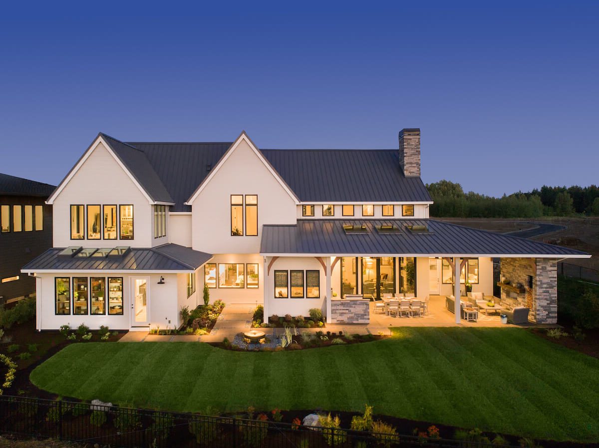wide angled external shot showing a large house featuring black framed windows